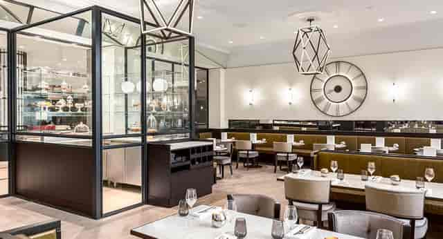 Elegant dining space at Grand Café Krasnapolsky for corporate events and upscale gatherings.