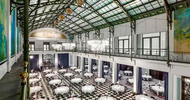 Elegant Wintergarden event space with high ceilings for weddings and corporate gatherings.