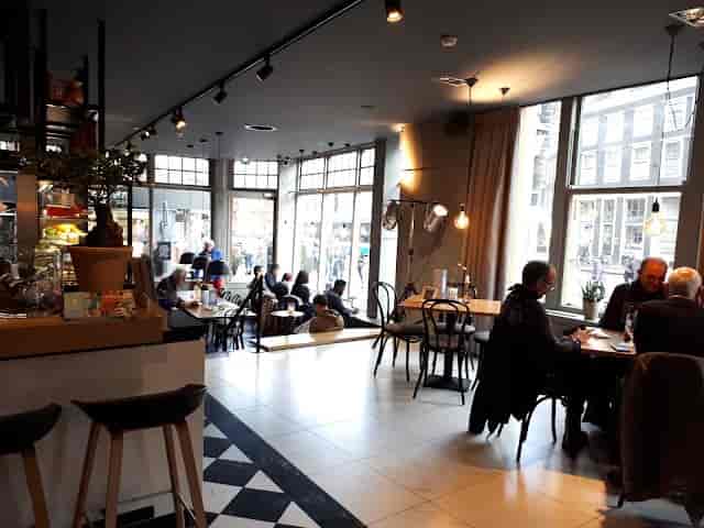 Modern café bar in Hulscher's with cozy seating for networking events and meetings.
