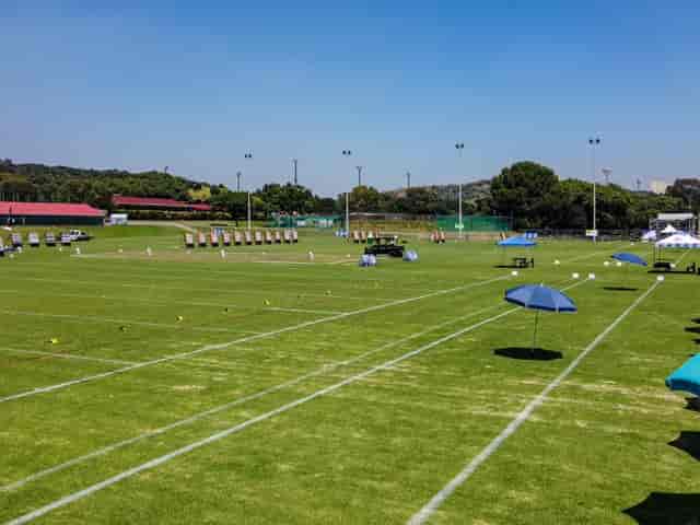 Spacious outdoor venue at Marks Park with umbrellas, perfect for events and competitions.
