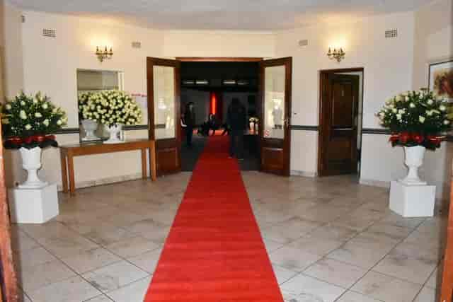 Elegant Pavilion Hall entrance with red carpet, perfect for sophisticated events.