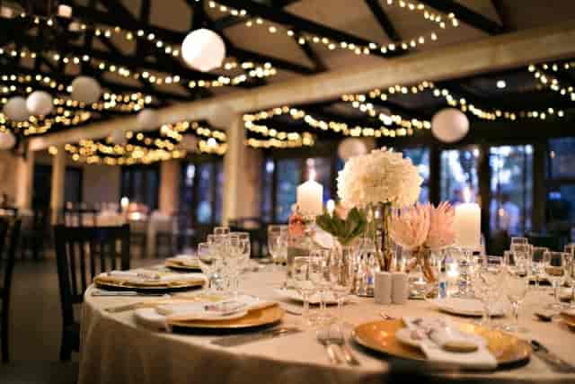Elegant dining room at Trés Jolie, perfect for sophisticated events with floral decor.
