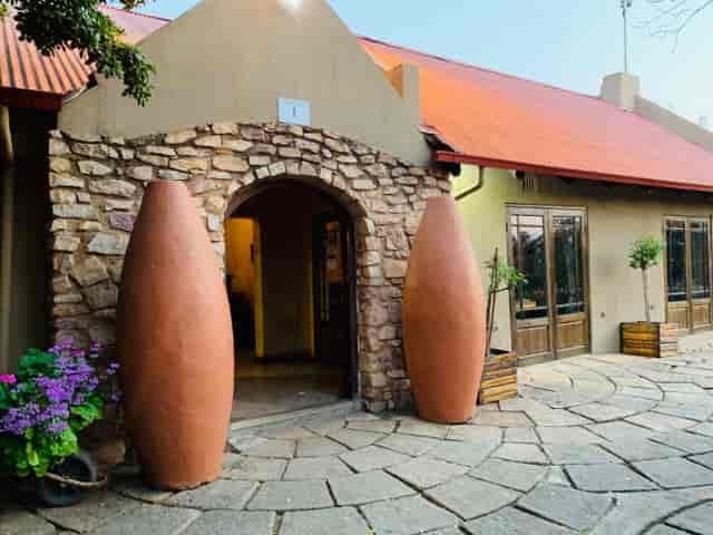 Rustic charm family restaurant entrance in Trés Jolie, perfect for events and gatherings.
