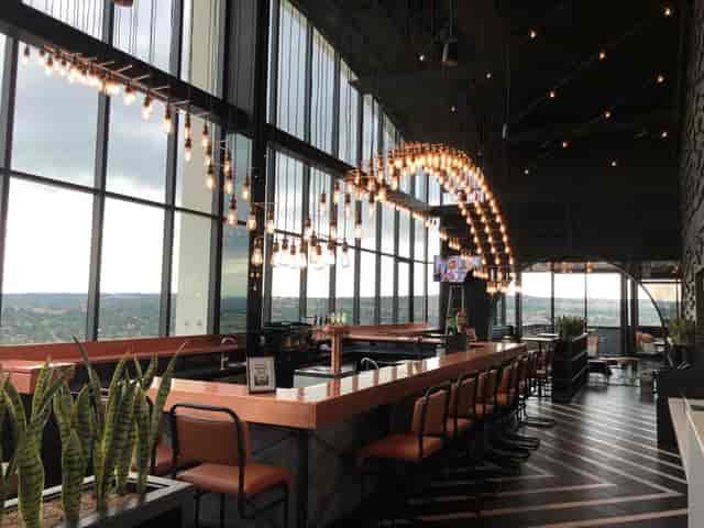 Contemporary lounge at Courtyard Hotel with large windows for events and networking.