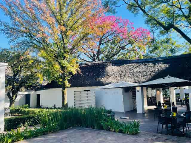 Outdoor spa venue at Indaba Hotel with lush greenery for meetings and events.