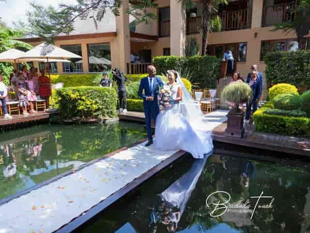 Outdoor wedding in The Elephant Hall, lush greenery, serene atmosphere, event venue.