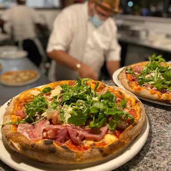 Gourmet pizzas with fresh toppings at SetteBello for catering events at The Italian Club