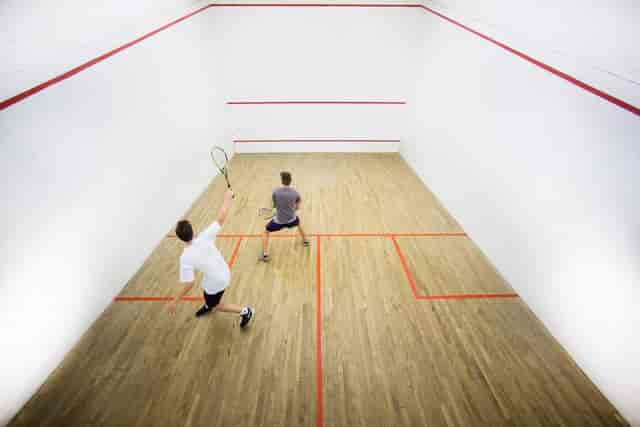 Squash players in the Palmyra Room, Kelvin Grove Club - corporate wellness event setting.
