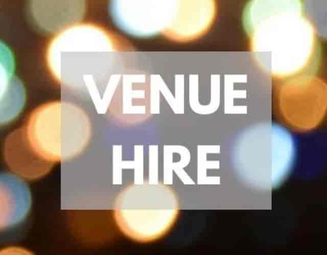 "Large Venue Hall at The Glen Club with vibrant lights for unforgettable events and gatherings."