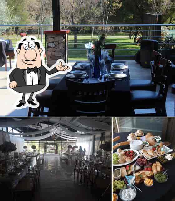 Elegant event space with set tables and buffet in Riverside restaurant venue.