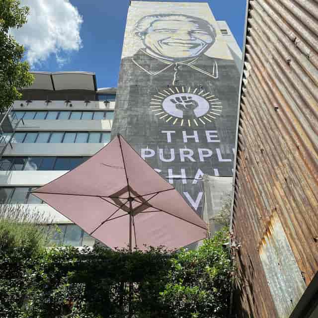 Modern event space on rooftop deck with mural, ideal for gatherings in Braamfontein.