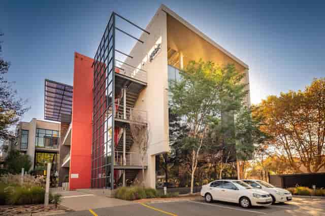 Modern event venue with glass facades, perfect for corporate gatherings in Houghton Terrace.