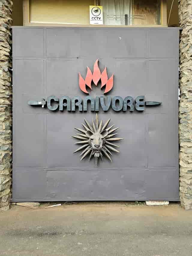 Carnivore Gardens entrance with lion motif - unique venue for corporate events and gatherings.