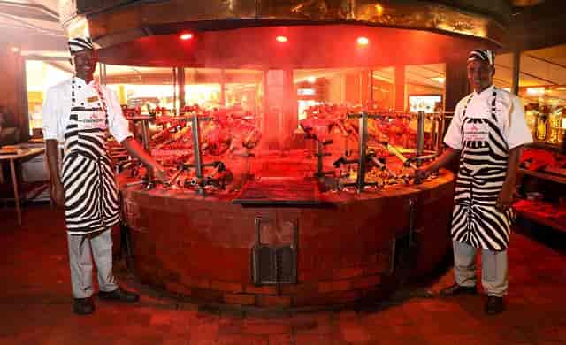 Vibrant dining area with zebra-striped chefs at The Carnivore event space, perfect for celebrations.