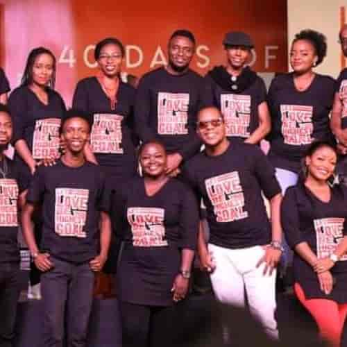 Diverse event staff in branded shirts at Karura Community Chapel, showcasing teamwork and engagement.