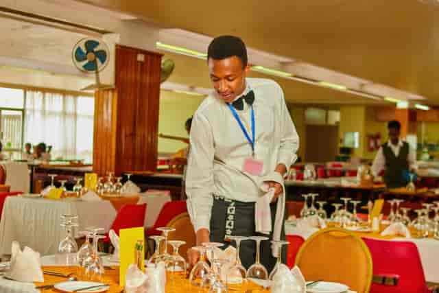 "Utalii Hotel restaurant event space set for a formal gathering with elegant table arrangements."