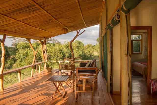 Lodges in Ol Pejeta Conservancy, serene wooden deck for team retreats and outdoor events.