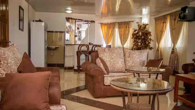 VIP lounge at Meru Paramount Hotel with elegant seating for meetings and networking.