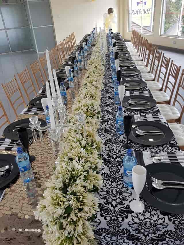 Elegant event table at Royal Nairobi Golf Club, black and white decor for upscale gatherings.