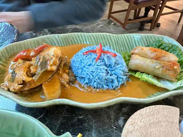 Vibrant blue rice dish at Mai Thai Deli for culinary events and multicultural menus.