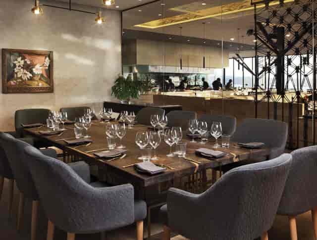 Private dining setup with crystal glassware in Marble Restaurant for corporate events.