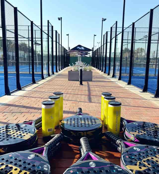 Vibrant tennis courts at The Wanderers Club for events and team-building activities.