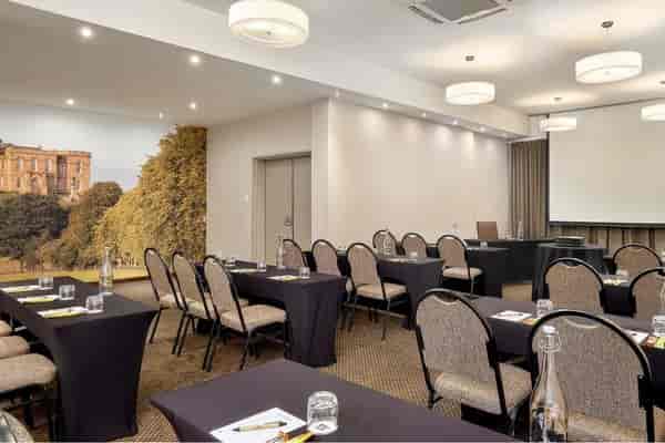 Conference room with elegant tables for professional workshops and presentations.