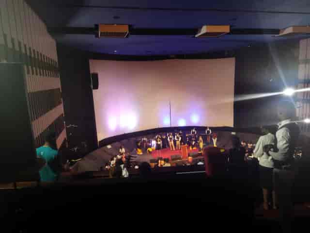Auditorium at Nairobi Film Centre with curved screen, ideal for events and conferences.
