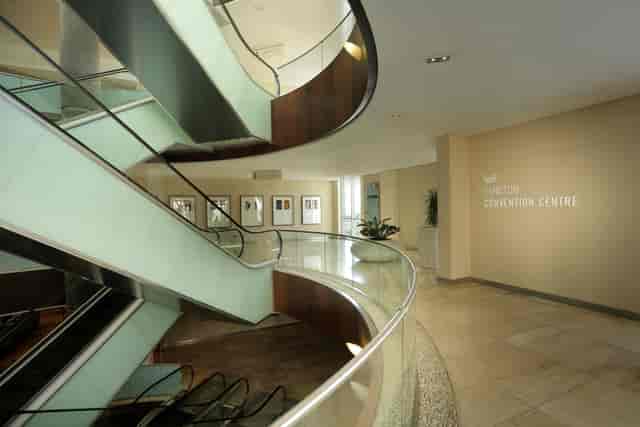 Modern staircase with glass railings at Sandton Convention Centre's committee rooms.