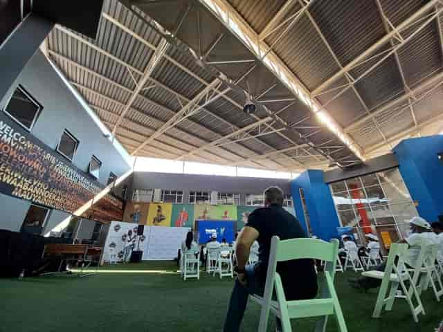 Outdoor business development venue with vibrant branding for presentations and networking events.