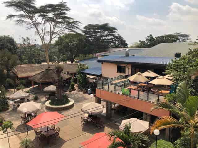 Banda Bar at Nairobi Gymkhana: spacious outdoor venue with umbrellas for events.
