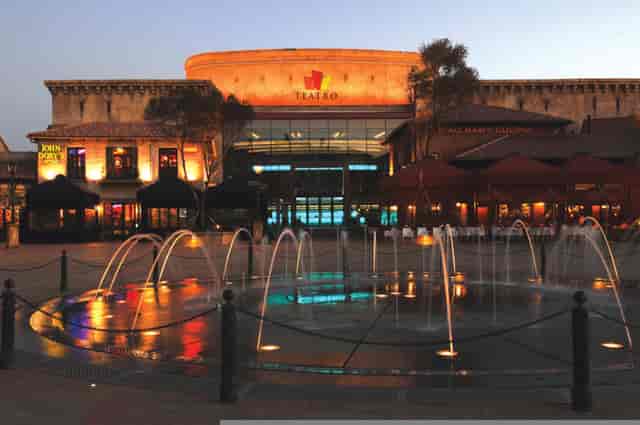 Illuminated Montecasino Theatre entrance at dusk, ideal for corporate events and receptions.