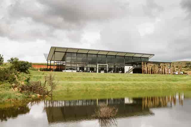 Poortjie Venue: modern glass facade, perfect for weddings and corporate events near water.
