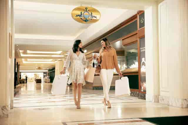 Two women shopping in The Table Bay ballroom, perfect for upscale events and VIP gatherings.