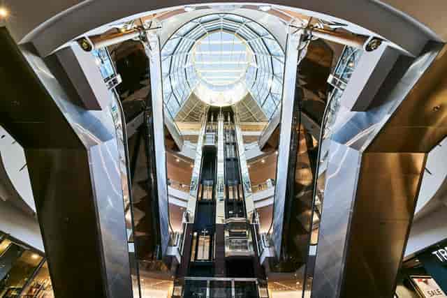 Spacious atrium with glass dome at Loads of Living Court, perfect for events and exhibitions.
