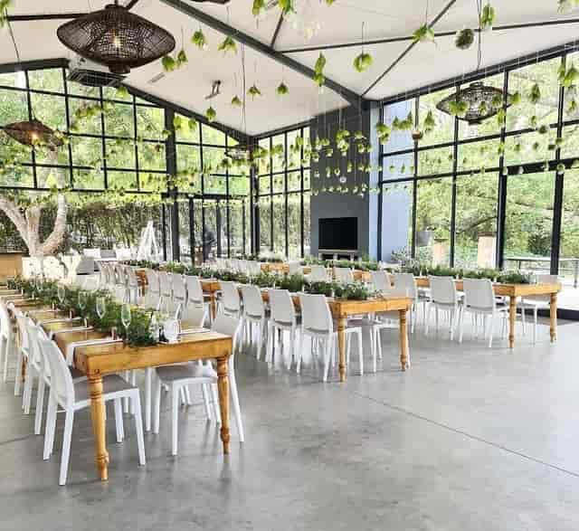 Main Hall in The Conservatory with long tables, perfect for weddings and corporate events.