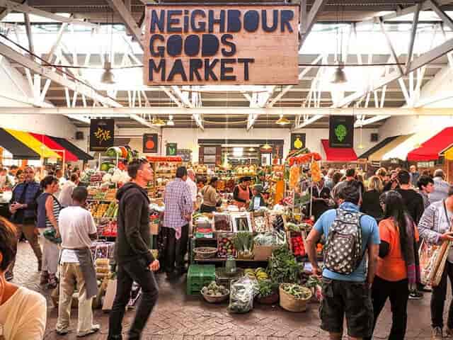 "Vibrant market scene at The Old Biscuit Mill for community events and networking."