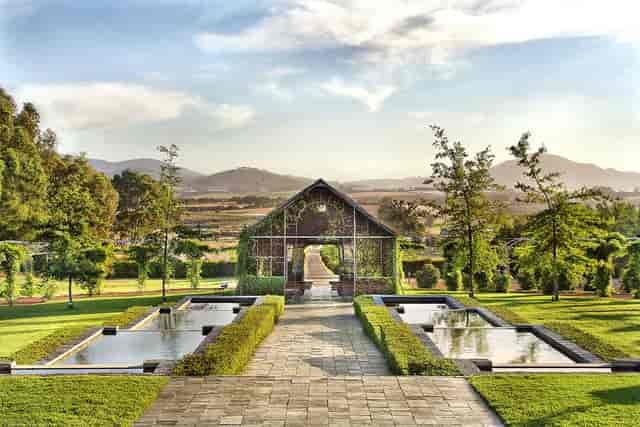 Outdoor ceremony area in Belair with lush greenery, perfect for events and gatherings.