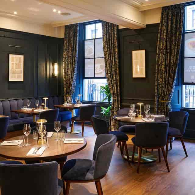 Elegant upstairs dining room in The Brasserie, ideal for corporate dinners and intimate events.