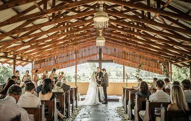 Rustic wedding ceremony at Buffet Hall, Cradle Valley with elegant decor and natural lighting.