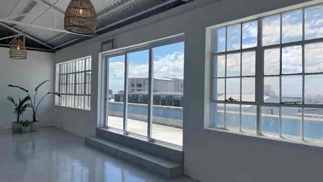 Outdoor terrace at The Terrace Rooftop with large windows, perfect for events and meetings.