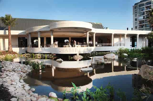 Modern lounge area at Oasis Retirement Resort with water feature for elegant events.