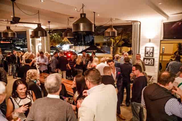 Family Table at Il Molo: vibrant networking event in a stylish, well-lit venue.