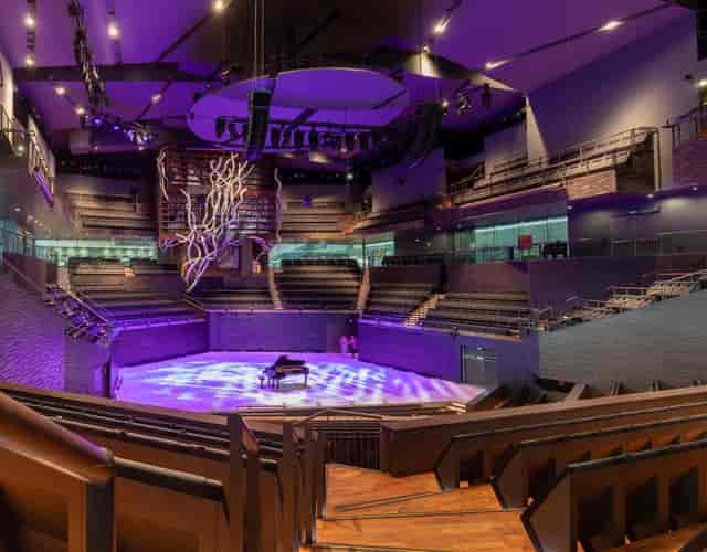 Music Hall in Stoa, modern performance venue with impressive stage, ideal for concerts and conferences.