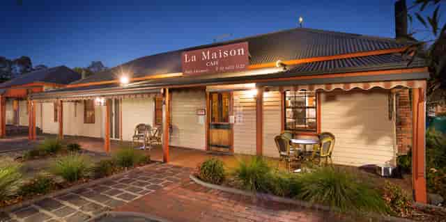 Charming café exterior at La Maison Restaurant for intimate gatherings and events.