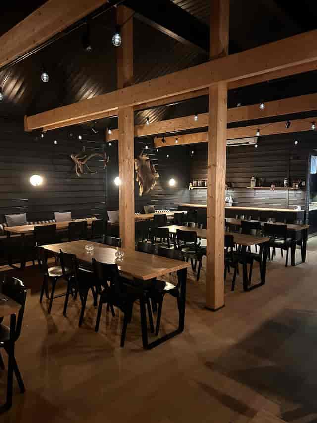 Rustic meeting space with wooden beams at Northern Lights Ranch for corporate retreats and workshops.