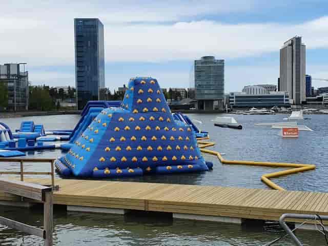 Inflatable water park in Laguuni, perfect for summer team-building events.