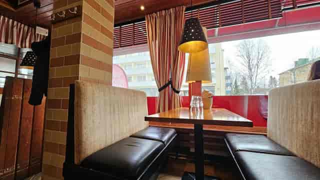 Cozy dining setup with plush seating at Casa Mare, ideal for casual gatherings and meetings.
