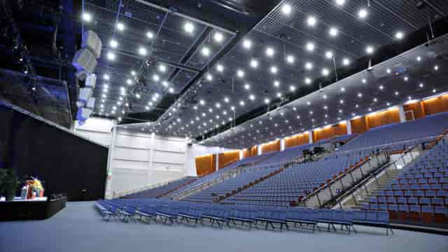 Spacious auditorium with tiered seating for versatile events at Messukeskus.