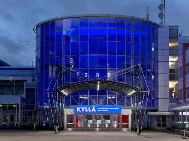 Modern Messukeskus Northern Entrance with blue glass façade, perfect for events and conferences.